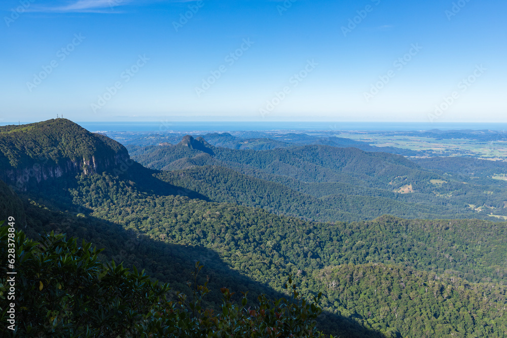 View over mountains, valley and ocean from The Best of All Lookout with blue sky