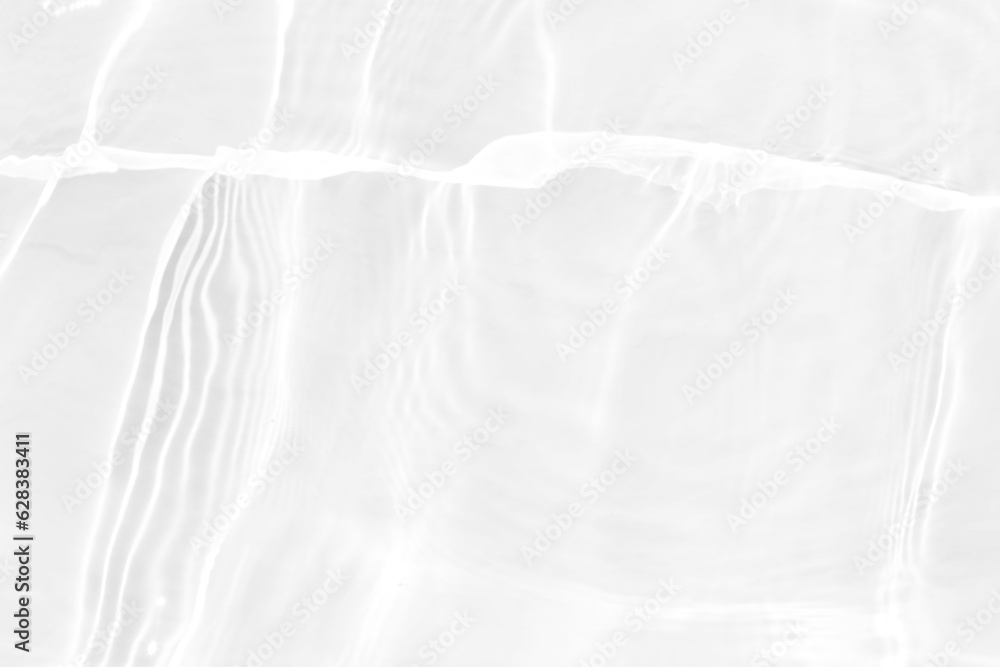 Obraz premium White water with ripples on the surface. Defocus blurred transparent white colored clear calm water surface texture with splashes and bubbles. Water waves with shining pattern texture background.