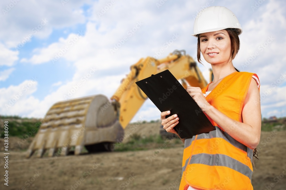 Happy young construction worker on site outside. Happy young construction worker on site outside.