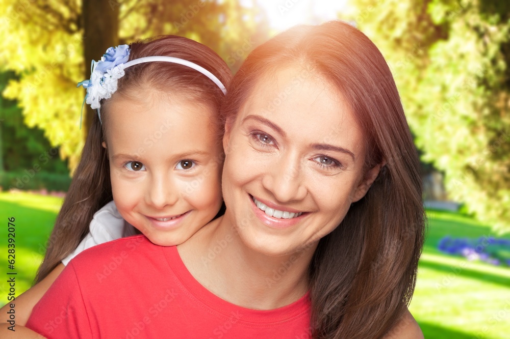 Young Mother with a small child, happy family outdoor. Young Mother with a small child, happy family outdoor.