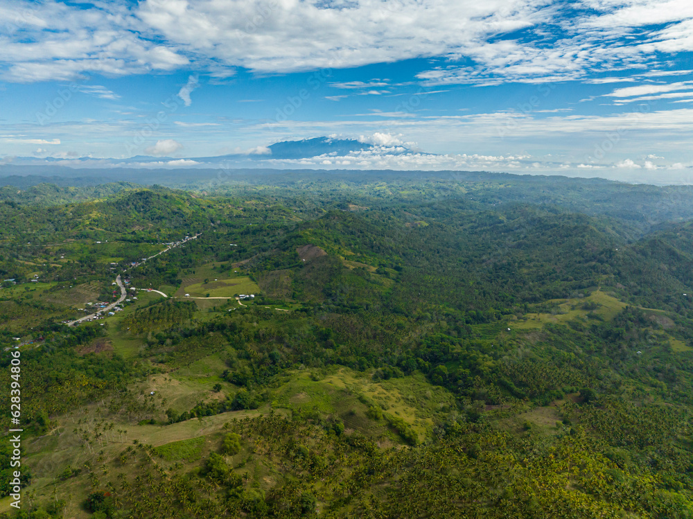 Tropical mountains covered rainforest, trees and jungle. Beautiful sky and clouds. Mindanao, Philippines. Tropical mountains covered rainforest, trees and jungle. Beautiful sky and clouds. Mindanao, Philippines.