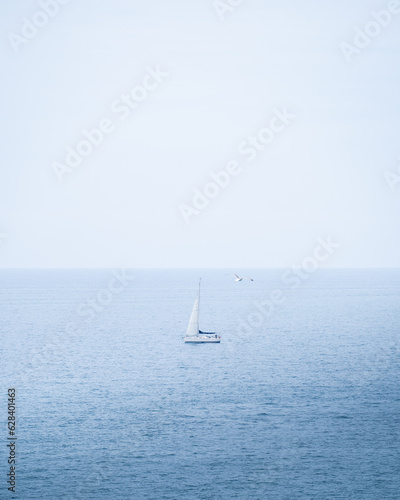Sail boat sailing alone on the blue sea in Portugal, Algarve © Peter