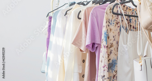 female  capsule summer wardrobe in  white room