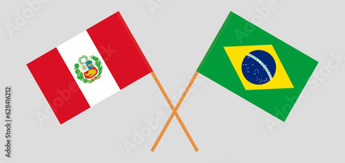 Crossed flags of Peru and Brazil. Official colors. Correct proportion