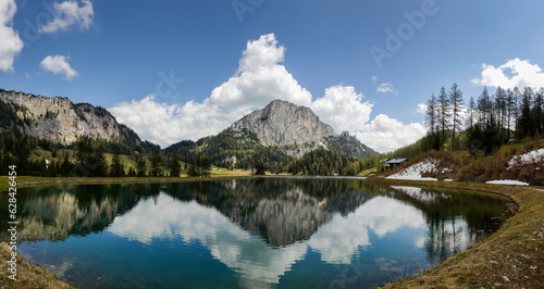 incredible view to a nature landscape with reflections in a mountain lake named wurzeralm in austria panorama