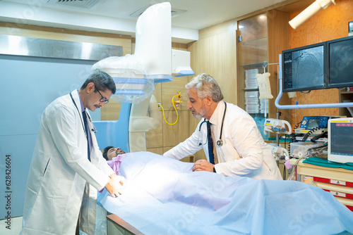 Doctor with patient in operation theater at hospital.