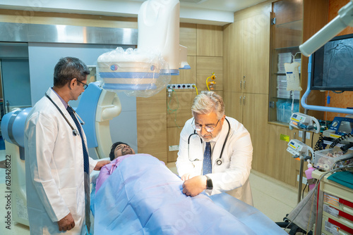 Doctors Performing Surgical Operation in Bright Modern Operating Room