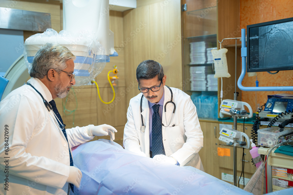 Doctors Performing Surgical Operation in Bright Modern Operating Room Doctors Performing Surgical Operation in Bright Modern Operating Room