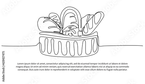 Croissant one continuous line design. Decorative elements drawn on a white background.