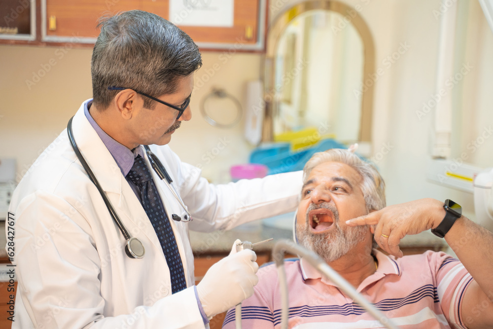 Fototapeta premium Dentist Checking patient teeth at hospital.