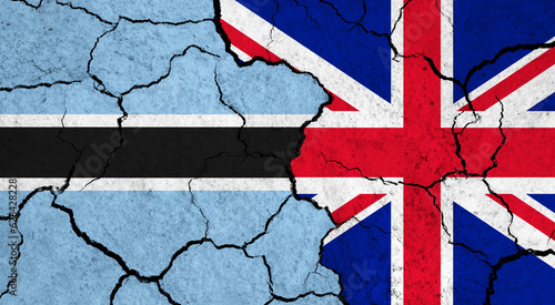 Flags of Botswana and United Kingdom on cracked surface - politics, relationship concept