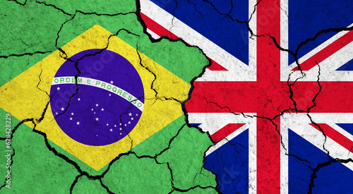 Flags of Brazil and United Kingdom on cracked surface - politics, relationship concept