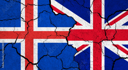 Flags of Iceland and United Kingdom on cracked surface - politics, relationship concept