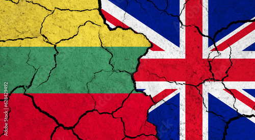Flags of Lithuania and United Kingdom on cracked surface - politics, relationship concept