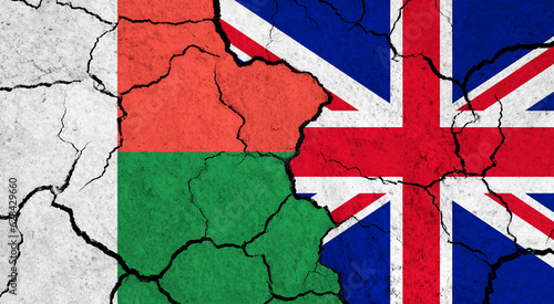 Flags of Madagascar and United Kingdom on cracked surface - politics, relationship concept
