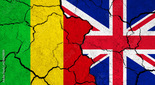 Flags of Mali and United Kingdom on cracked surface - politics, relationship concept