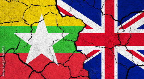 Flags of Myanmar and United Kingdom on cracked surface - politics, relationship concept