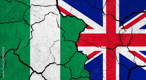 Flags of Nigeria and United Kingdom on cracked surface - politics, relationship concept