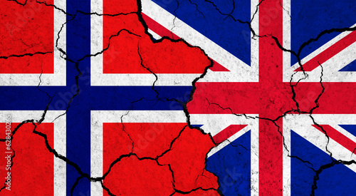 Flags of Norway and United Kingdom on cracked surface - politics, relationship concept