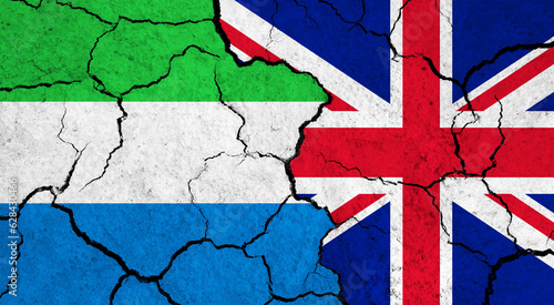 Flags of Sierra leone and United Kingdom on cracked surface - politics, relationship concept
