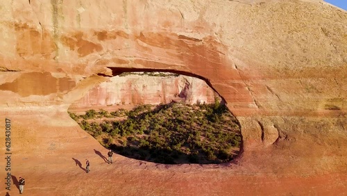 Wilsons Arch, Utah. Drone Shot Flying Through Natural Sandstone Arch Formation. Aerial FPV Drone View  1 of 4 photo