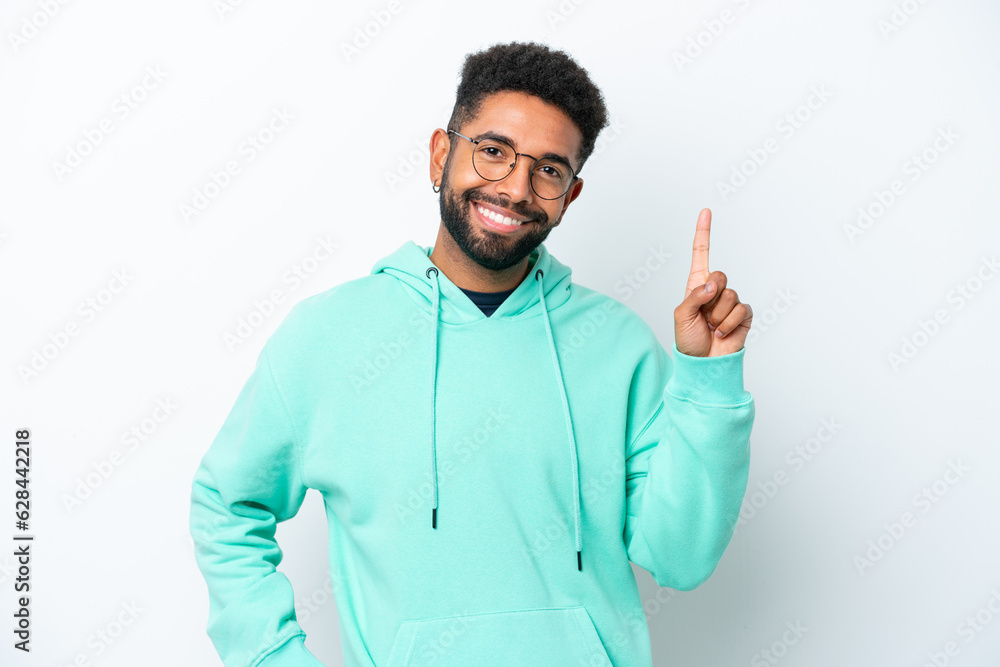 Young Brazilian man isolated on white background showing and lifting a finger in sign of the best Young Brazilian man isolated on white background showing and lifting a finger in sign of the best