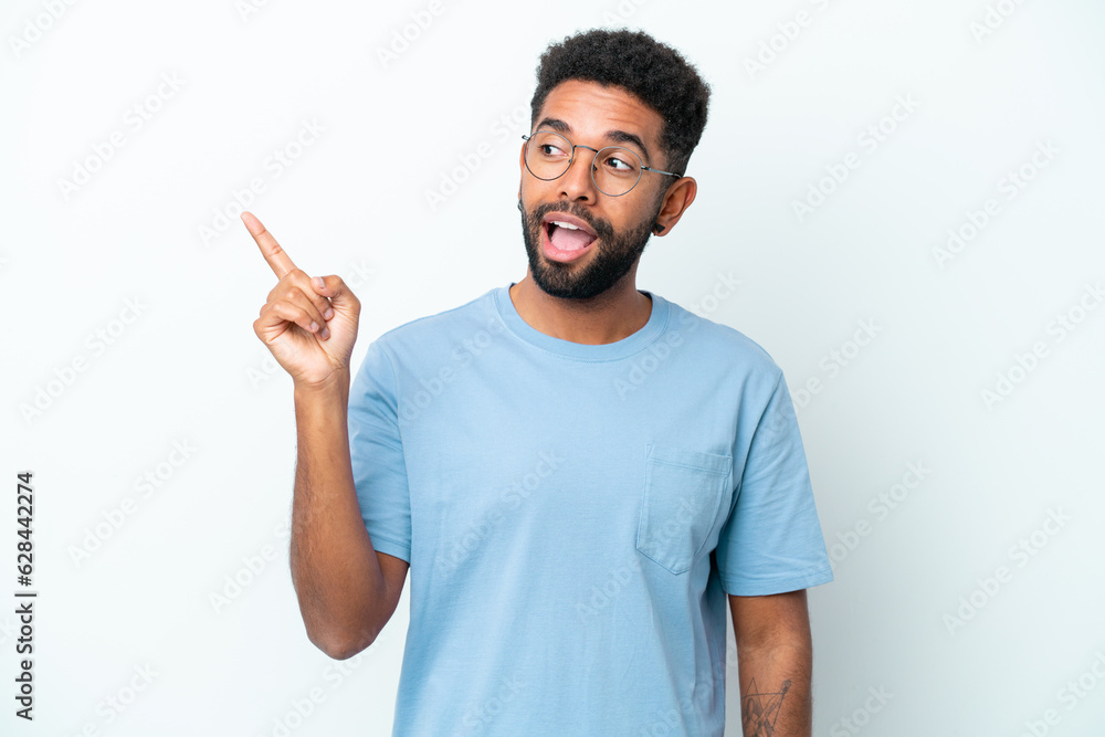 Young Brazilian man isolated on white background intending to realizes the solution while lifting a finger up Young Brazilian man isolated on white background intending to realizes the solution while lifting a finger up