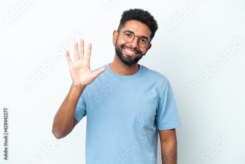 Young Brazilian man isolated on white background counting five with fingers
