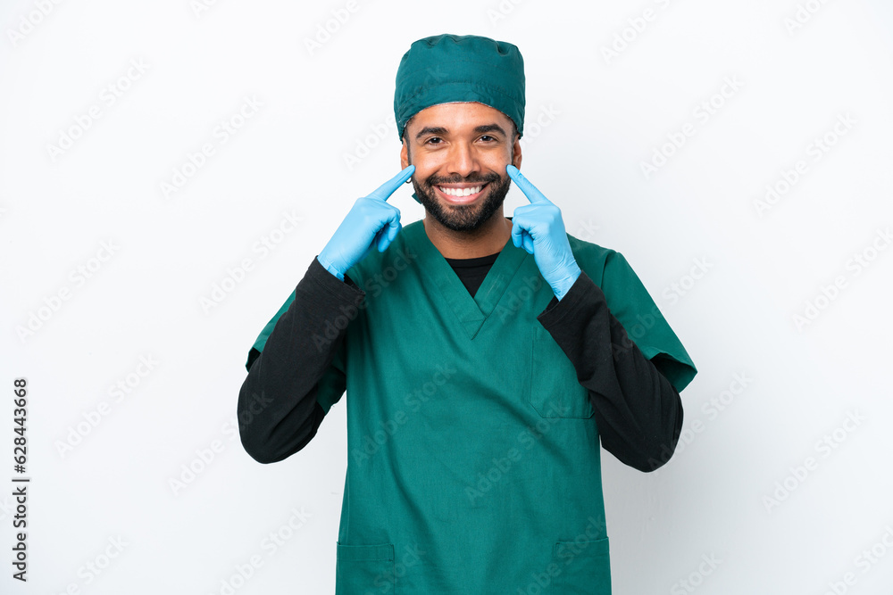 Surgeon Brazilian man in green uniform isolated on white background smiling with a happy and pleasant expression Surgeon Brazilian man in green uniform isolated on white background smiling with a happy and pleasant expression