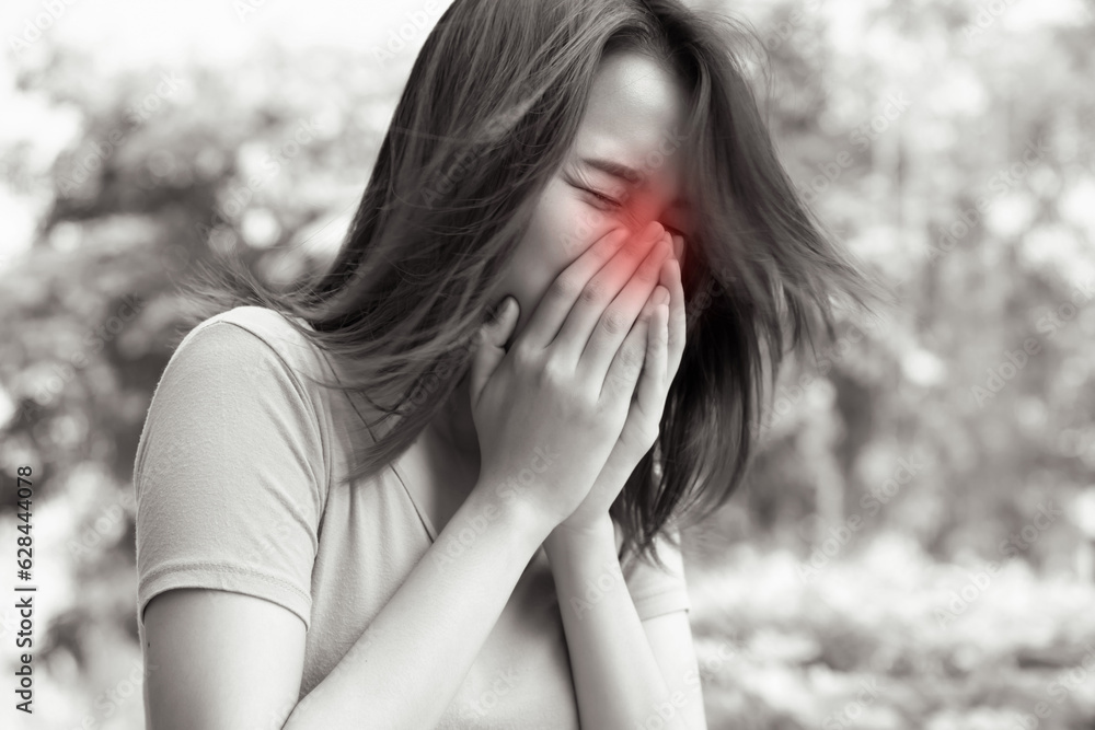 sick woman sneezing with sore throat; sick woman with allergic sneeze