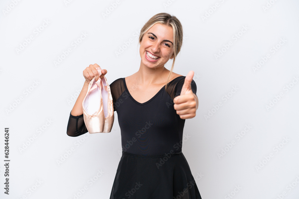 Young caucasian woman practicing ballet isolated on white background with thumbs up because something good has happened Young caucasian woman practicing ballet isolated on white background with thumbs up because something good has happened
