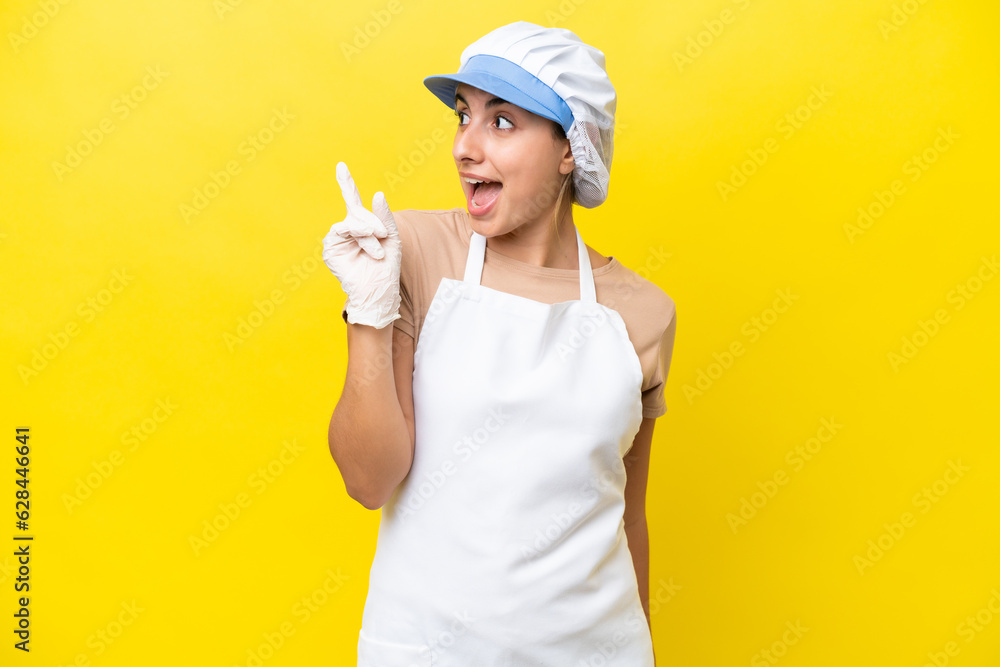 Fishwife woman over isolated background intending to realizes the solution while lifting a finger up Fishwife woman over isolated background intending to realizes the solution while lifting a finger up
