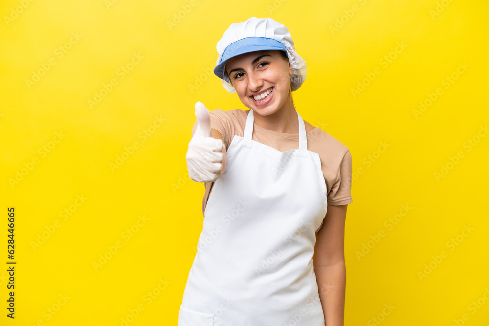 Fishwife woman over isolated background with thumbs up because something good has happened