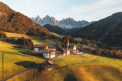 Drone photo of church and village in Santa Maddalena Magdalena Dolomites Italy