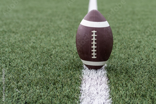 Football near the 50 yard line photo