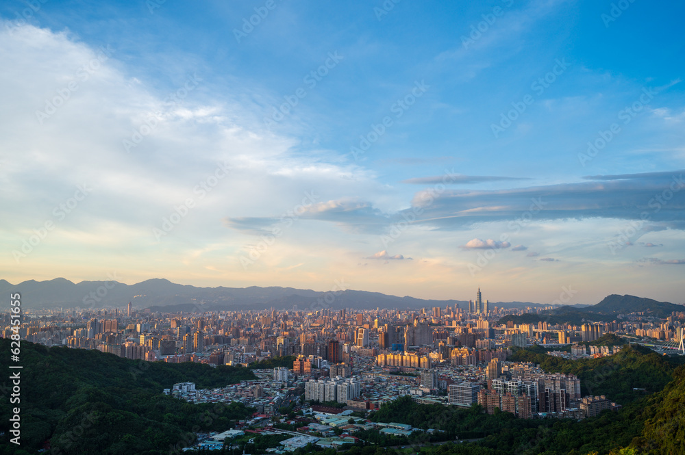 At dusk with blue sky and white clouds, clean and beautiful cityscape. Zhonghe Hongludi (Earth God Temple) is located in Nanshijiao Mountain,