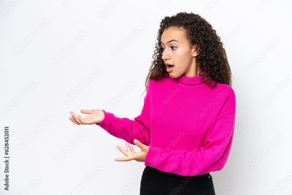 Young Arab woman isolated on white background with surprise expression while looking side Young Arab woman isolated on white background with surprise expression while looking side
