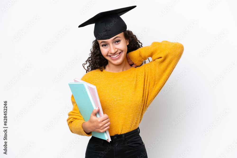 Arab university graduate woman holding books isolated on white background laughing Arab university graduate woman holding books isolated on white background laughing