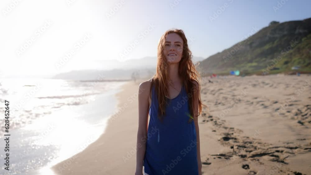 Attractive woman walking on the beach at sunset. Slow Motion. Attractive woman walking on the beach at sunset. Slow Motion.