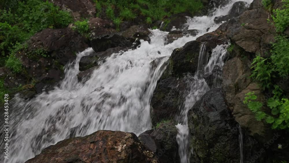 Beautiful natural waterfall in the mountains Beautiful natural waterfall in the mountains