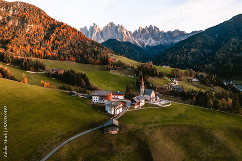 Drone photo of church and village in Santa Maddalena Magdalena Dolomites Italy