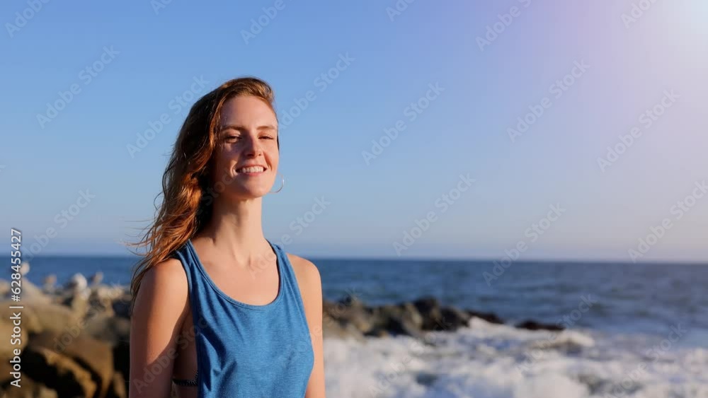 Portrait of an attractive woman at the beach at sunset. Slow Motion. Portrait of an attractive woman at the beach at sunset. Slow Motion.