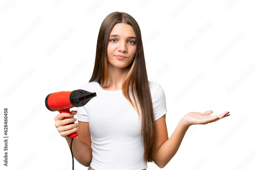 Teenager Caucasian girl holding a hairdryer over isolated background making doubts gesture while lifting the shoulders Teenager Caucasian girl holding a hairdryer over isolated background making doubts gesture while lifting the shoulders