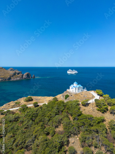 Fototapeta Naklejka Na Ścianę i Meble -  The Church of Agios Nikolaos in the new port of Myrina, Limnos with the cruise ship in the background