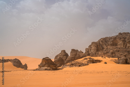 iew in the Sahara desert of Tadrart rouge tassili najer in Djanet City   Algeria.colorful orange sand  rocky mountains