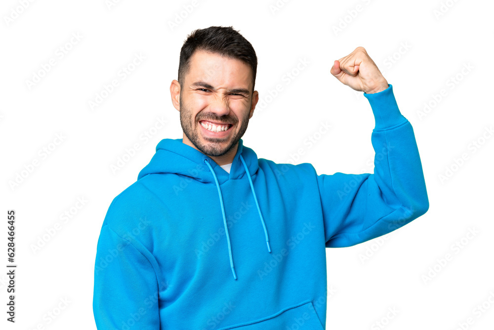 Young handsome caucasian man over isolated chroma key background doing strong gesture Young handsome caucasian man over isolated chroma key background doing strong gesture