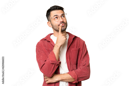 Fotografie Young handsome caucasian man over isolated chroma key background having doubts w