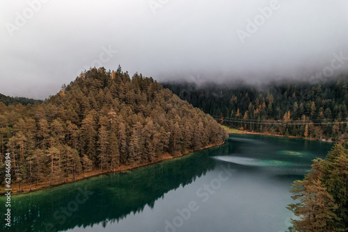 Moody Aerial photo of Fernsteinsee lake in Austria in autumn season  photo