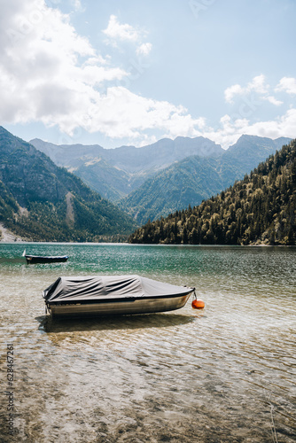 Boats at Lake Plansee, mountain lake in Austria close to Germany, Bavarian Alps