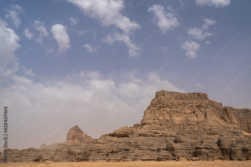 iew in the Sahara desert of Tadrart rouge tassili najer in Djanet City ,Algeria.colorful orange sand, rocky mountains iew in the Sahara desert of Tadrart rouge tassili najer in Djanet City ,Algeria.colorful orange sand, rocky mountains
